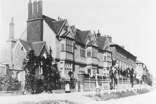 A maid stands outside Egerton House 1918