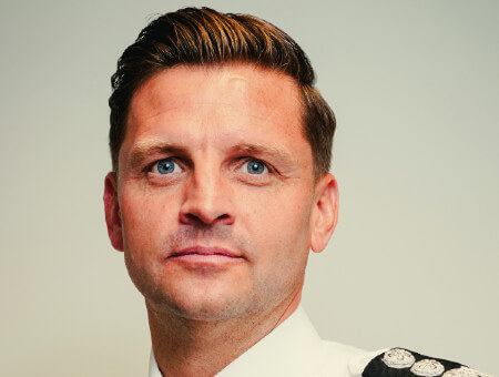 Alex Woodman looking serious in colour