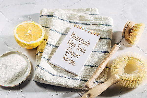 Natural cleaning products lemon, bamboo dish brushs with notebook. Eco friendly. Zero waste concept. Plastic free.