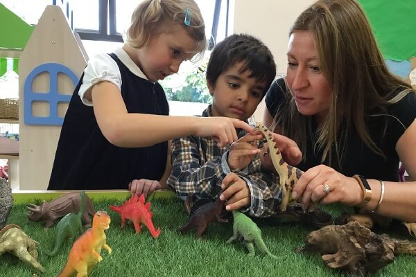 Lockers Park School Pupils Playing with Dinosaurs