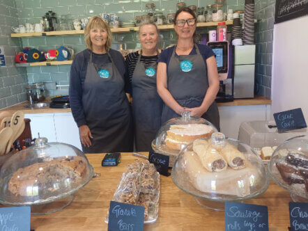 Long Marston residents and volunteers Elaine (left) and Jensigne (right), with Helena (centre) at Home Ground café
