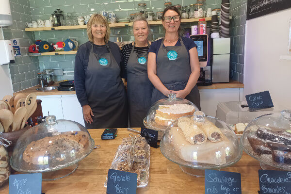 Long Marston residents and volunteers Elaine (left) and Jensigne (right), with Helena (centre) at Home Ground café