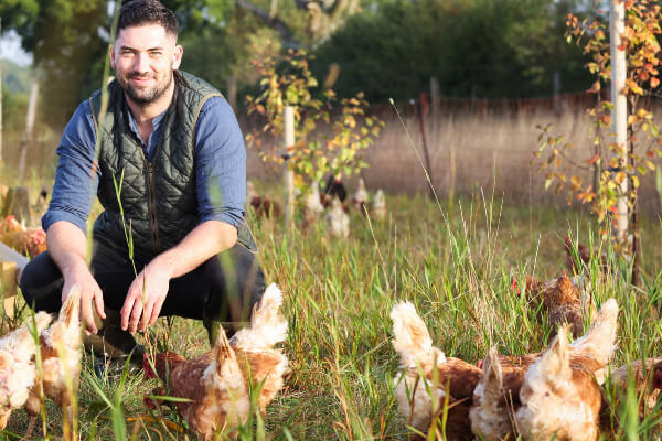 Max at Cheyneys with pasture-fed chickens at Hill Farm Ashridge