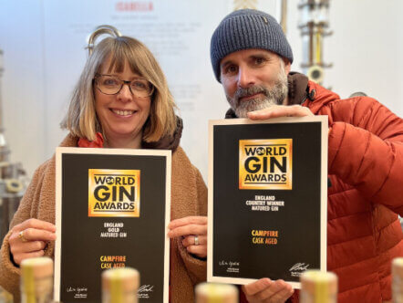 Puddingstone Distillery's Kate & Ben with World Gin Awards certificates