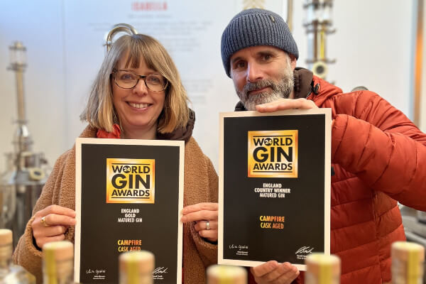 Puddingstone Distillery's Kate & Ben with World Gin Awards certificates