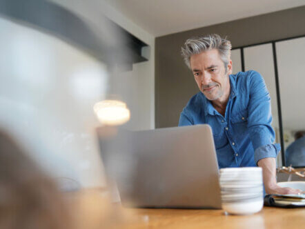 Mature man working from contemporary home