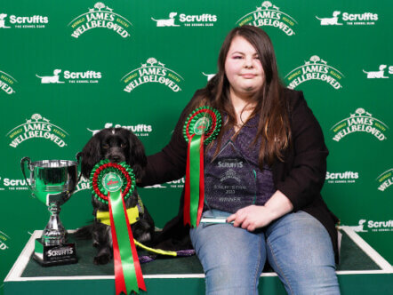 Living Magazines The Scruffts Good Citizen Dog Scheme winner, Delilah with their owner Francesca Cairns, sponsored by James Wellbeloved at Crufts 2023.