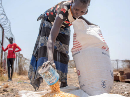 Living Magazines South Sudanese Woman Receiving Rations of Maize