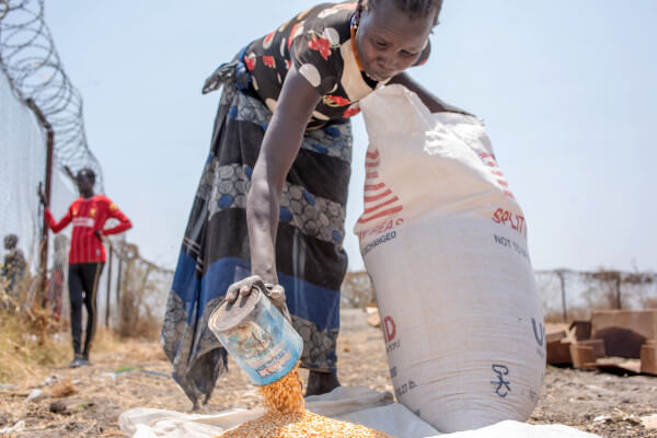 Living Magazines South Sudanese Woman Receiving Rations of Maize