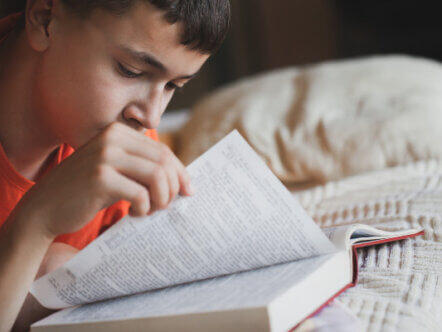 Teenager reading book