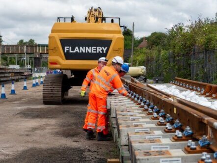 Track workers inspecting panels at Roade ahead of Hanslope Junction renewal