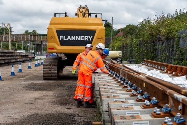 Track workers inspecting panels at Roade ahead of Hanslope Junction renewal
