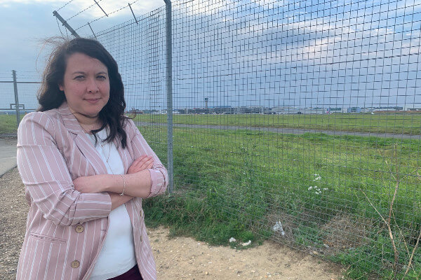 Victoria Collins MP at airport perimeter fence