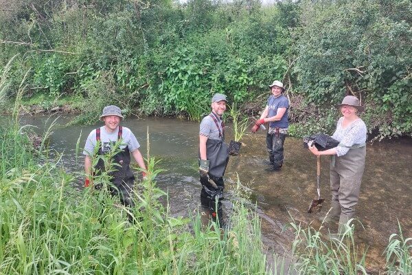 Volunteers planting in the River Ash © Sarah Perry
