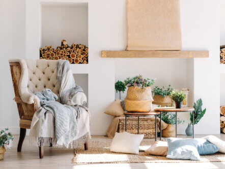 Interior bright living room Scandinavian style with large armchair, coffee table, plants