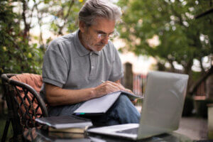 senior-man-doing-online-classes-laptop